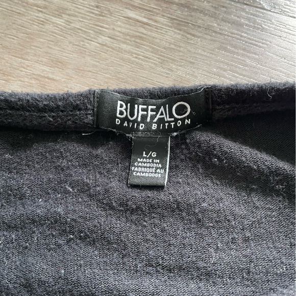 Longer black sweater with white stars. - Picture 3 of 6